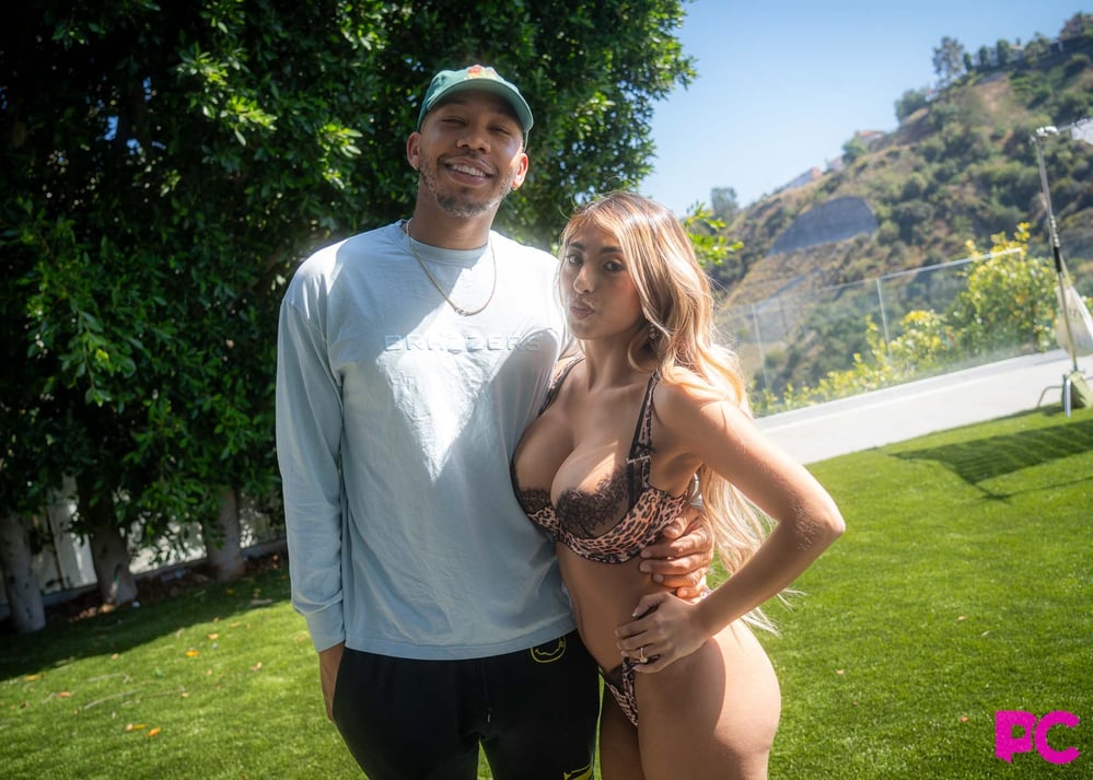 Director and performer Ricky Johnson poses with a performer on the lawn at PornCrush Media Day 2026.
