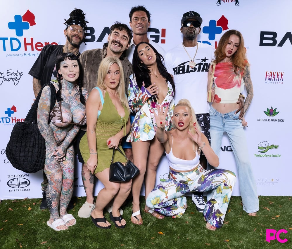 Performers and guests pose on the sponsor step-and-repeat at the fourth annual PornCrush pool party.